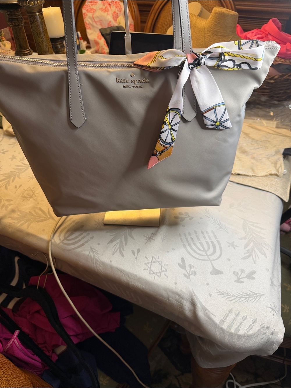 kate spade light gray tote with decorative scarf accent
